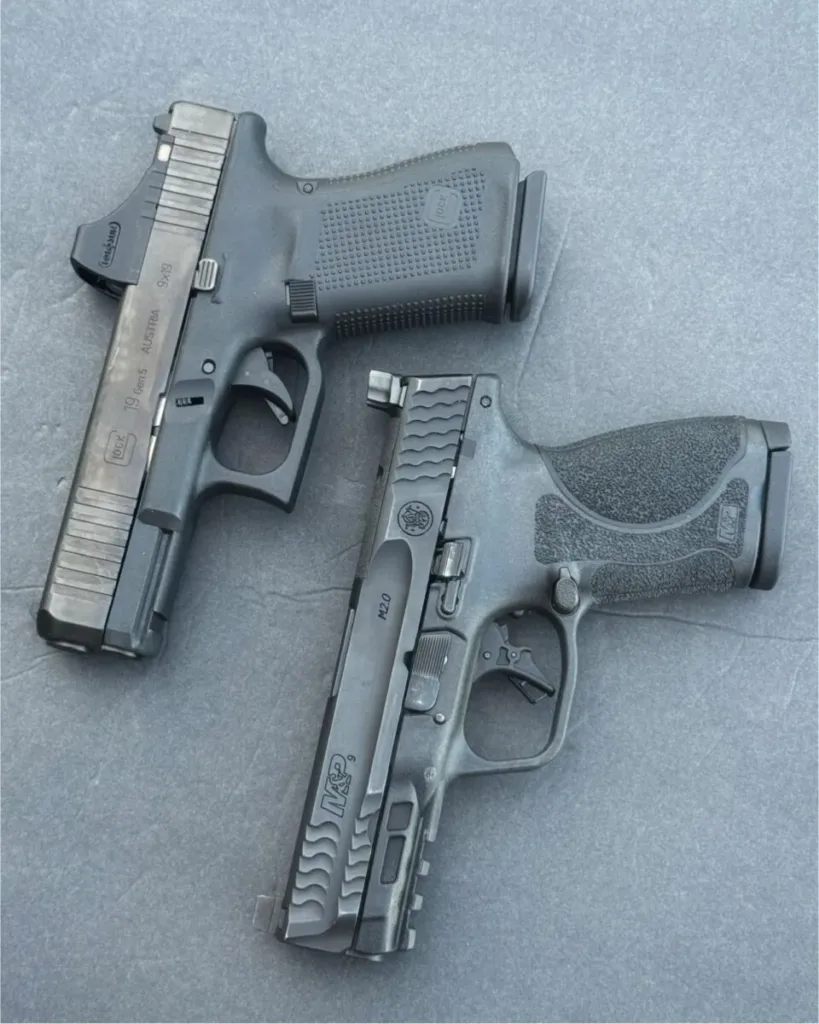 Side-by-side comparison of a Smith & Wesson M&P 2.0 Compact and a Glock 19